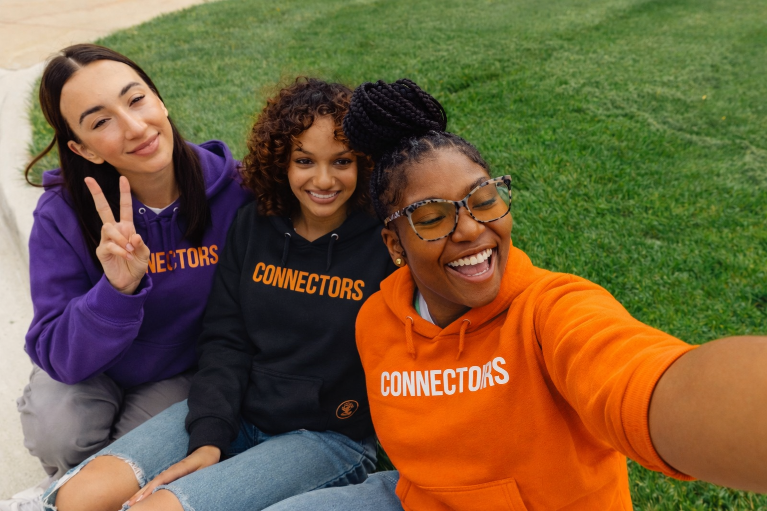 Three youth ambassadors taking a selfie